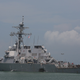 Damage to the USS John S. McCain is visible as it steers towards Changi Naval Base in Singapore following a collision (U.S. Navy photo by Mass Communication Specialist 2nd Class Joshua Fulton/Released)